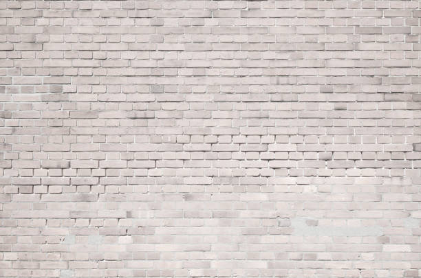istock White old brick wall with traces of mortar repair 1327751110