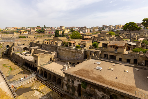 Herculaneum, Campania, Italy - June 29, 2021: Ruins of an ancient city destroyed by the eruption of the volcano Vesuvius in 79 AD near Naples, Archaeological Park of Ercolano