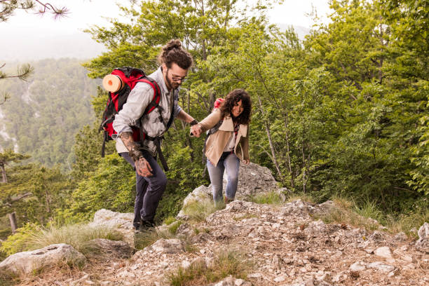 istock Come on honey, I will help you to climb this rocky mountain! 1327756892