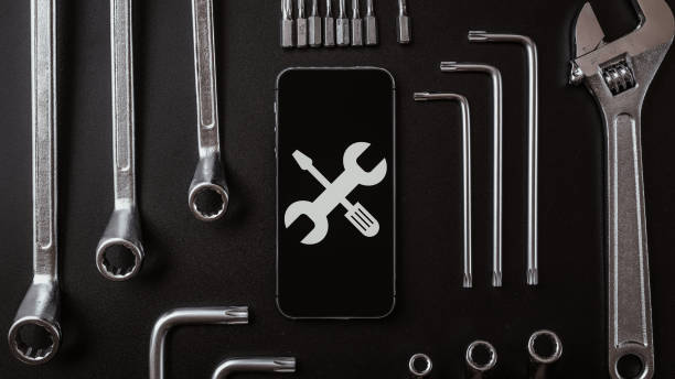 istock Mobile repair service. Technician workplace with phone and special repairing tools. Electronics repair service, device production concept. 1327756970