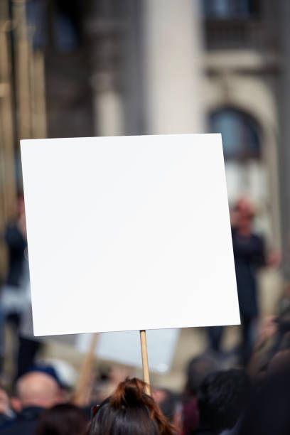 istock Protesters holding placards and signs on the streets. 1327757934
