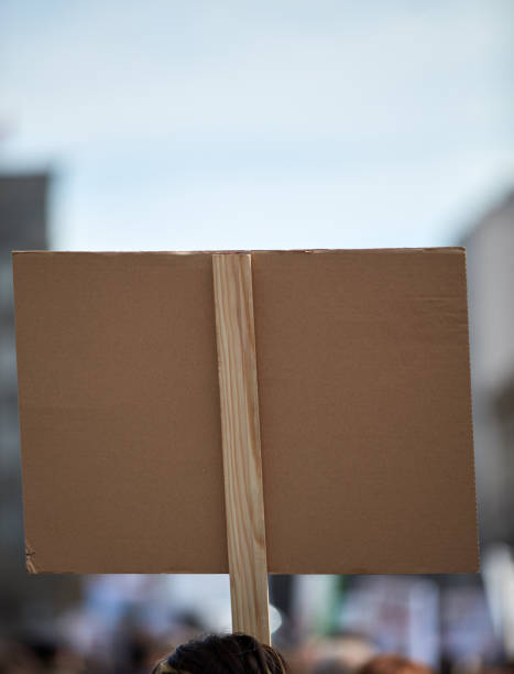 istock Protesters holding placards and signs on the streets. 1327757954