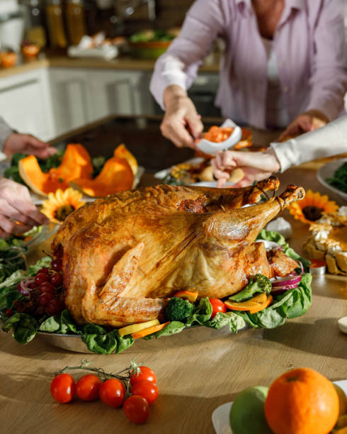 istock Unrecognizable people preparing a meal for Thanksgiving day. 1327758762