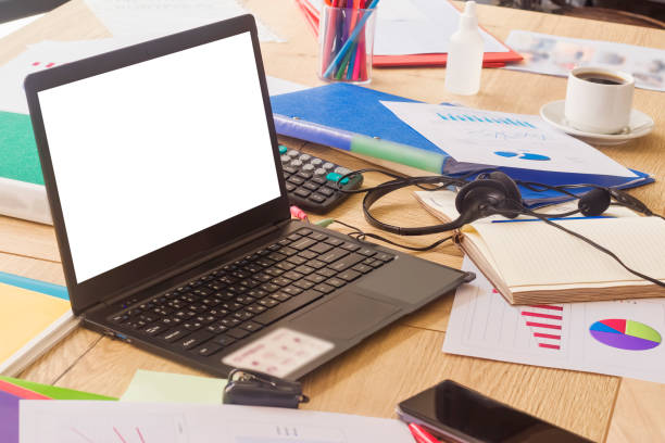istock Empty space for text. Workplace in the office. Laptop with white blank screen, graphs, charts, documents, papers, folders. 1327759875