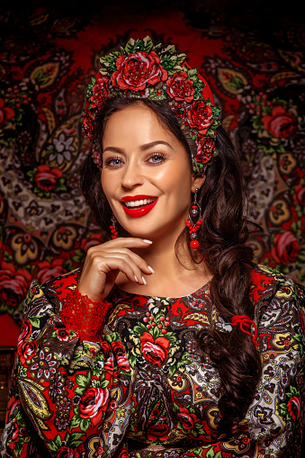 Female Russian beauty queen in a traditional dress in a studio shot