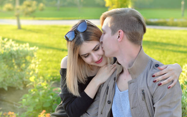 istock A young man kisses a girl 1327764145