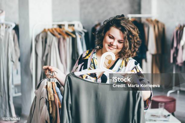 Plus Size Woman Choose Fashioned Dress In Store Plus Size Women Shopping Stock Photo - Download Image Now