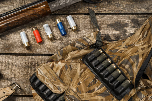istock Various hunting equipment on old wooden background 1327768361