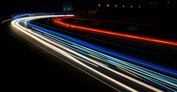 istock lights of cars with night. 1327768399