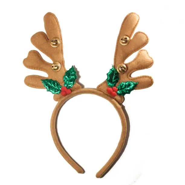 Photo of Christmas reindeer antlers. New year deer headband isolated on white