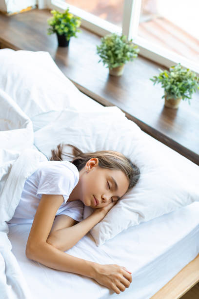 istock A 10-year-old girl sleeping under a blanket 1327773740