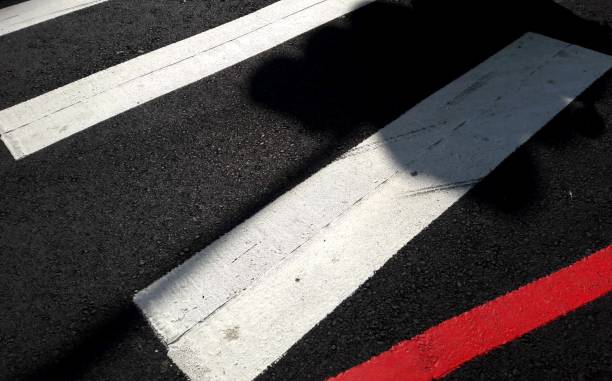 istock Asphalt road with marking lines white stripes texture. Zebra crossing, pedestrian crosswalk on asphalt road 1327774012