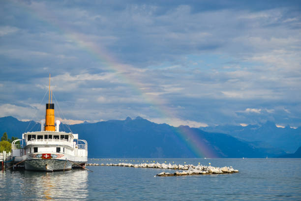istock Boat on Lac Leman with rainbow 1327778830