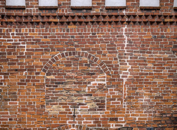 Walled up window in a church wall at an old church in Nykøbing Falster which is a town in the southern part of Denmark