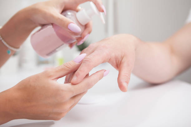 istock Manicurist working with male client 1327780760