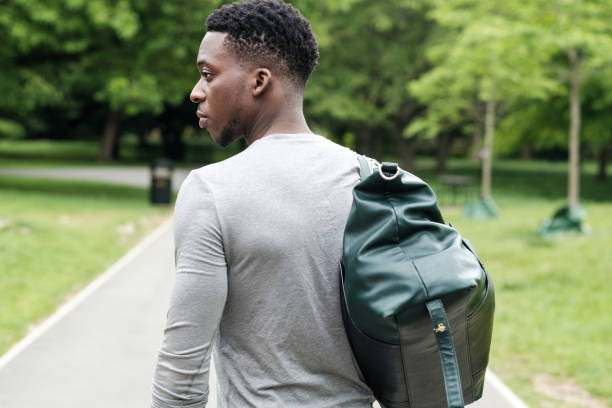 istock Fit young black man going to training with gym bag. 1327782032