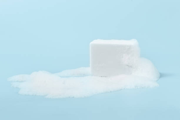 istock hand made soap in lush white foam on a light blue background. cosmetic background minimalistic concept 1327783344