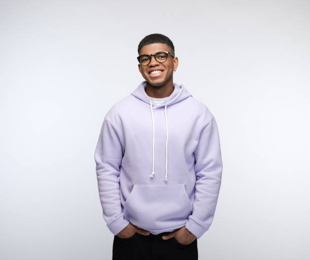 cheerful young man wearing lilac hoodie - huvtröja bildbanksfoton och bilder