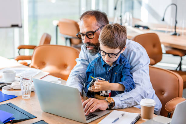 istock Father and son working in his office. 1327786016