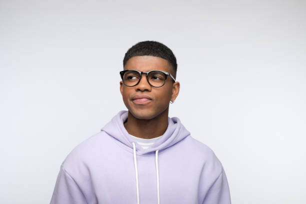istock Doubtful young man wearing lilac hoodie 1327786168