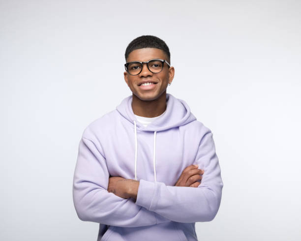istock Friendly young man wearing lilac hoodie 1327787478