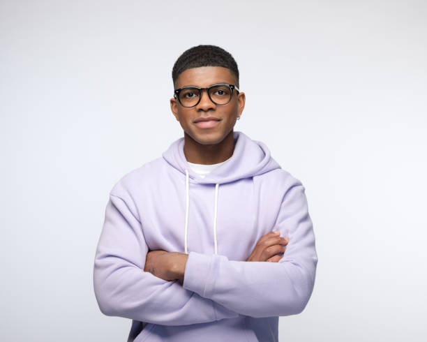 istock Friendly young man wearing lilac hoodie 1327788087
