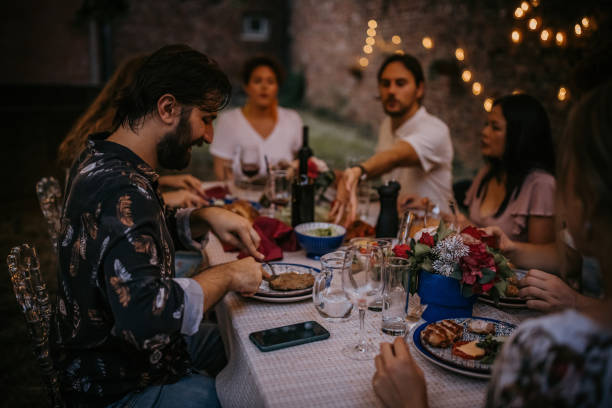 istock Group of friends on dinner party 1327788169
