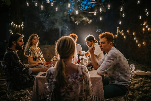 istock Friends on dinner party in back yard 1327788232