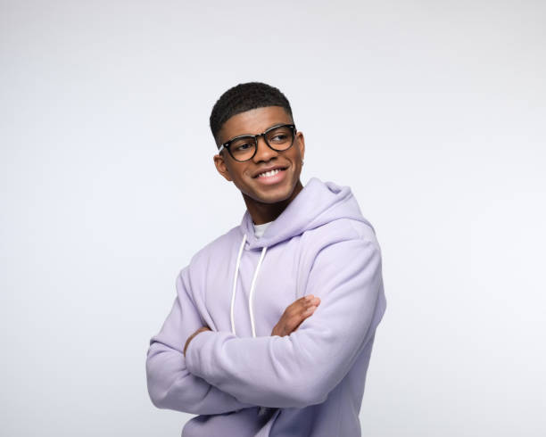 istock Friendly young man wearing lilac hoodie 1327788272