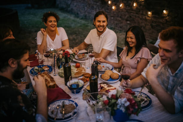istock Friends on dinner party in back yard 1327788315