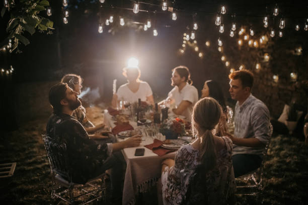 istock Friends on dinner party in back yard 1327788356