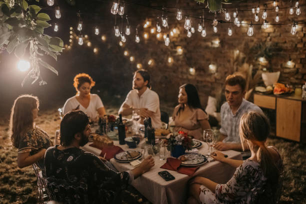 istock Friends on dinner party in back yard 1327788372