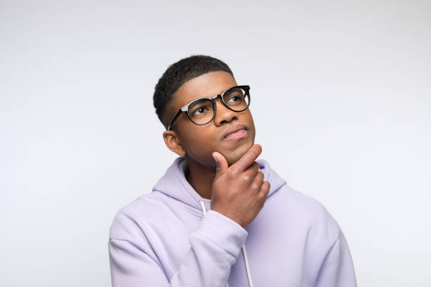 istock Thoughtful young man wearing lilac hoodie 1327789420