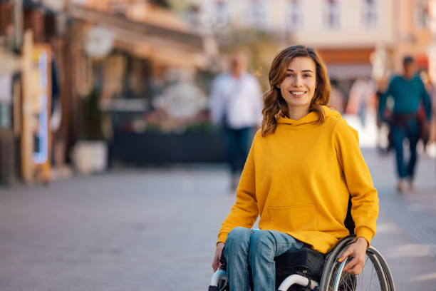 Adult woman, getting ready for lunch. Portrait of disabled woman, deciding which restaurant to go to. wheelchair stock pictures, royalty-free photos & images