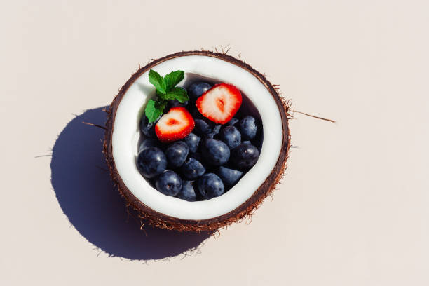 istock Half of coconut full of berries 1327791665