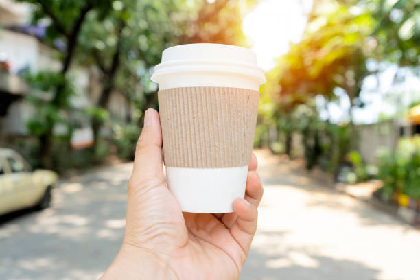 istock Hands holding a coffee cup that can be recycled. 1327791694