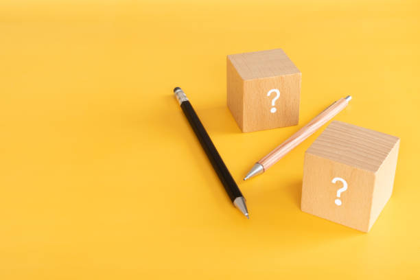 istock Way of studying; Wooden blocks with a question mark and two pencils. 1327793328