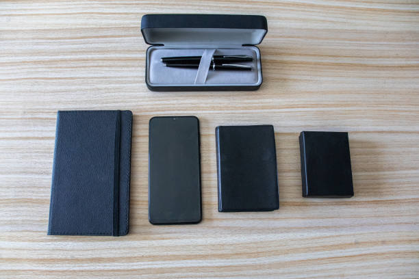 istock pencil notebook phone and box standing on the table 1327793674