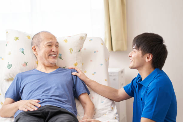 istock Smiley caregiver and the elderly 1327794650