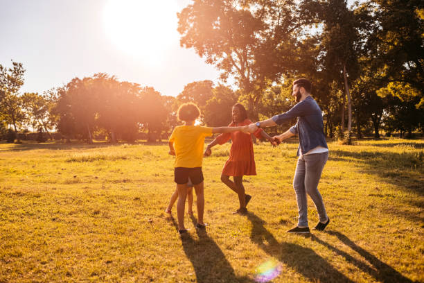 Happy family playing ring around the rosy