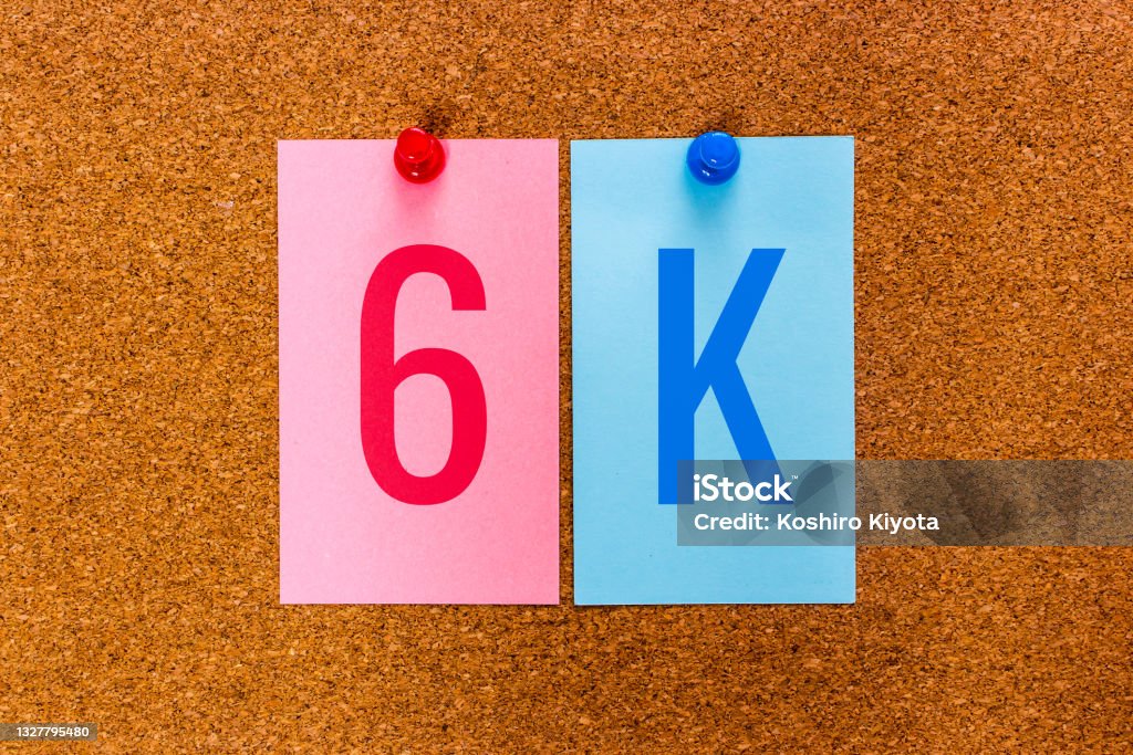 Conceptual 2 letters keyword 6K on multicolored stickers attached to a cork board Conceptual 2 letters keyword 6K on multicolored stickers attached to a cork board. 6K resolution refers to a horizontal display resolution of approximately 6000 pixels. Full Stock Photo