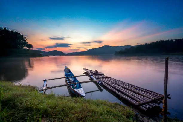 Sermo reservoir is located in Kulon Progo, Yogyakarta. Here you can see a beautiful sunrise with a fishing boat.