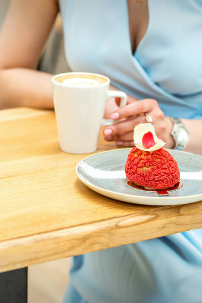 istock Young female drinking coffee in cafe 1327798849