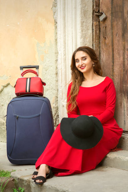 istock Woman sitting on threshold house 1327798972