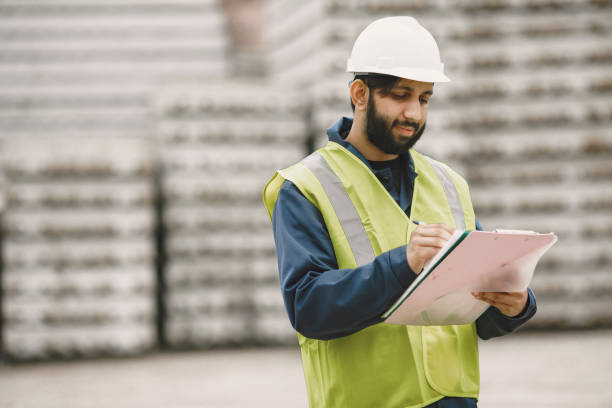 istock Civil engineer working outside with helmet 1327801450