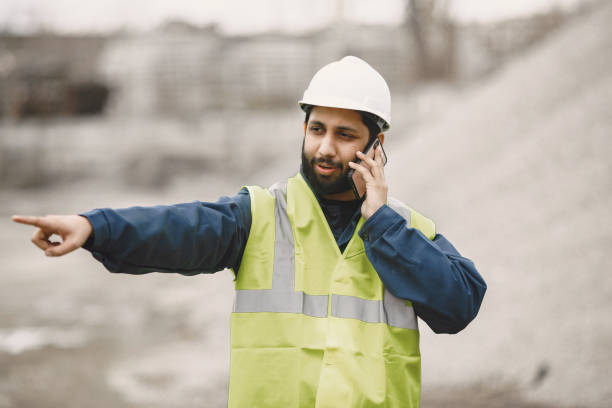 istock Civil engineer working outside with helmet 1327801522