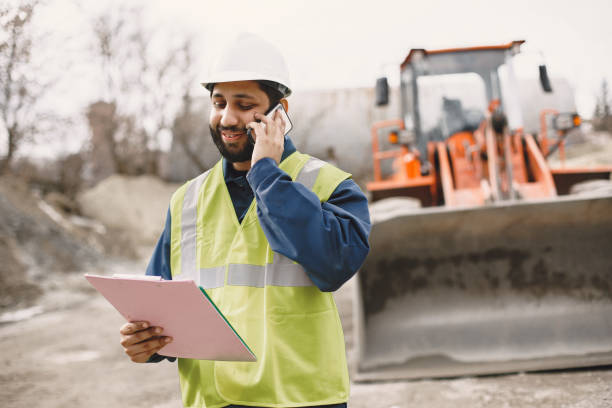 istock Civil engineer working outside with helmet 1327801755