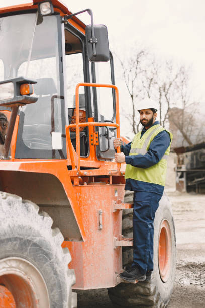 istock Civil engineer working outside with helmet 1327801773