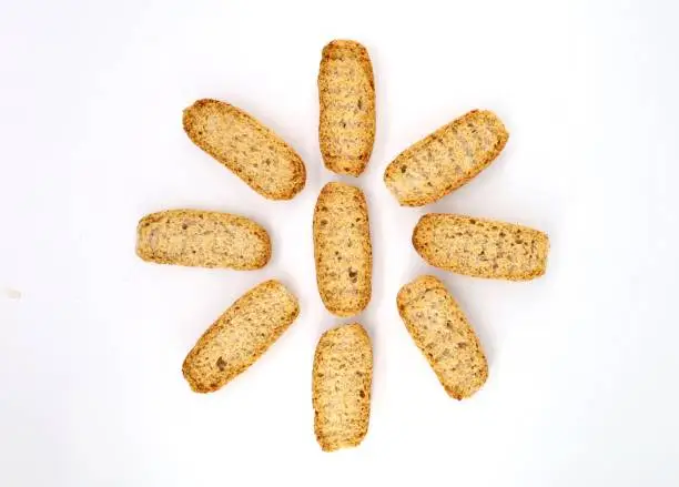 Oval slices of toasted bread used for italian appetizers as Crostino o Bruschetta, adding then a topping above. White background.