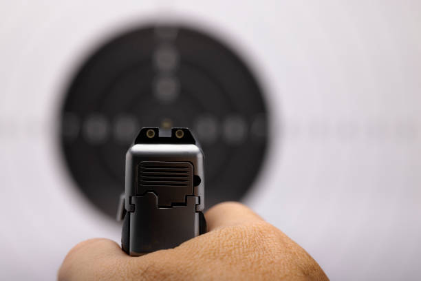 istock Close up at rear gun sight aiming to Bull eye target 1327808992